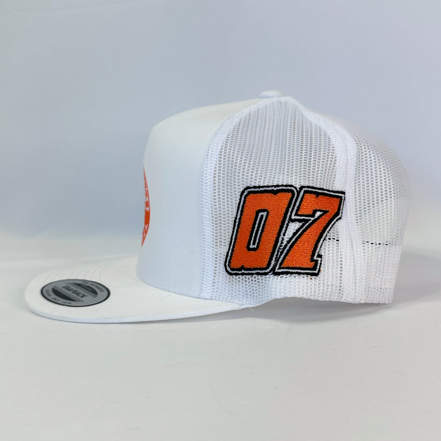 Fresh White Nic Ramsay Racing #07 Trucker Hat, Authentic Yupoong, showing the front logo and full stitching.